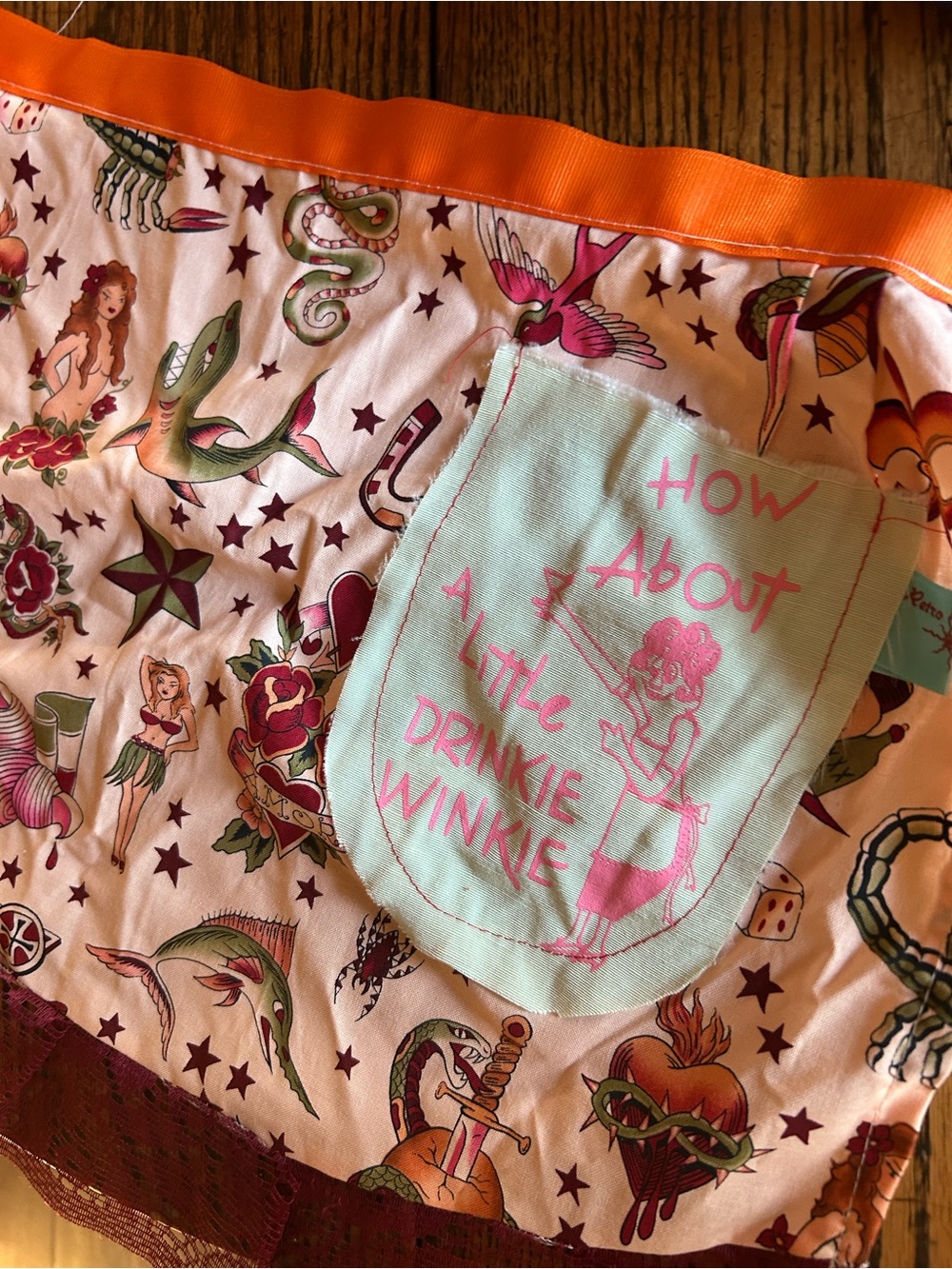 Orange-Trim Novelty Print Apron with Mint Pocket